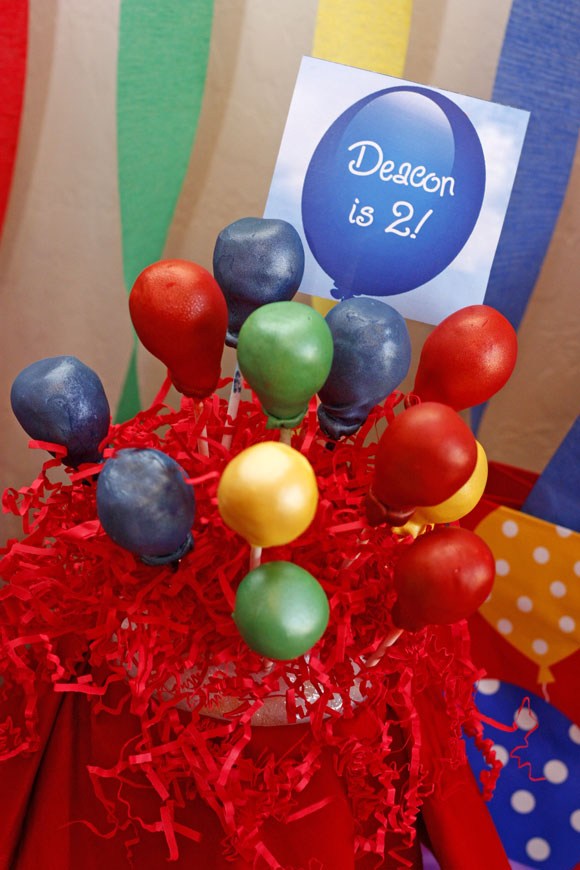 cake pops in primary colors in the shape of balloons